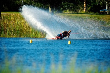 a man riding a wave on a surfboard in the water